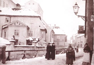 The Medveščak stream flowing between old houses in winter
